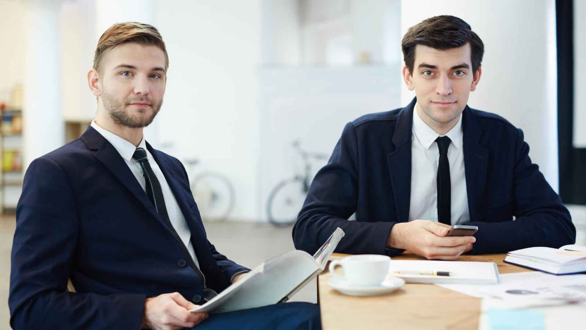 two professional skilled worker sitting at a table